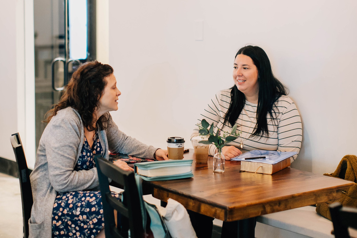 women meeting and chatting over coffee