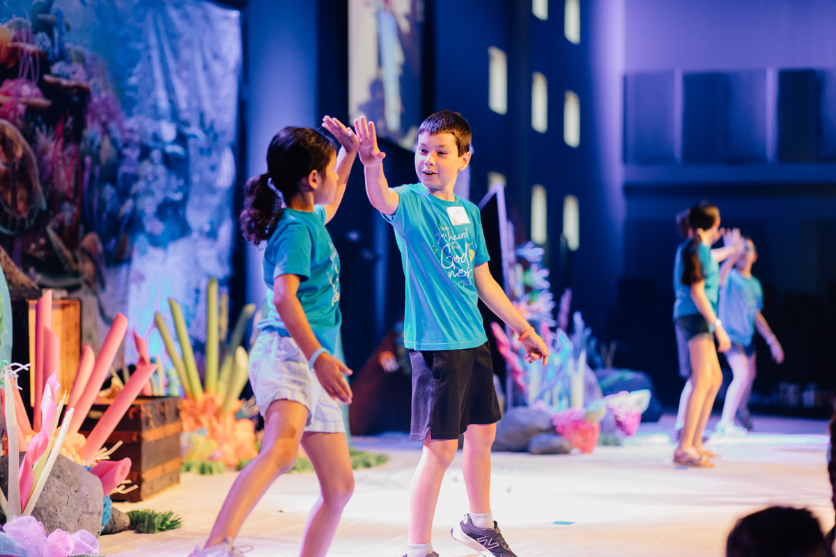 Kids High Fiving At VBS