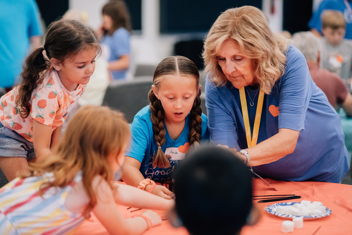 VBS Teacher Helping Students