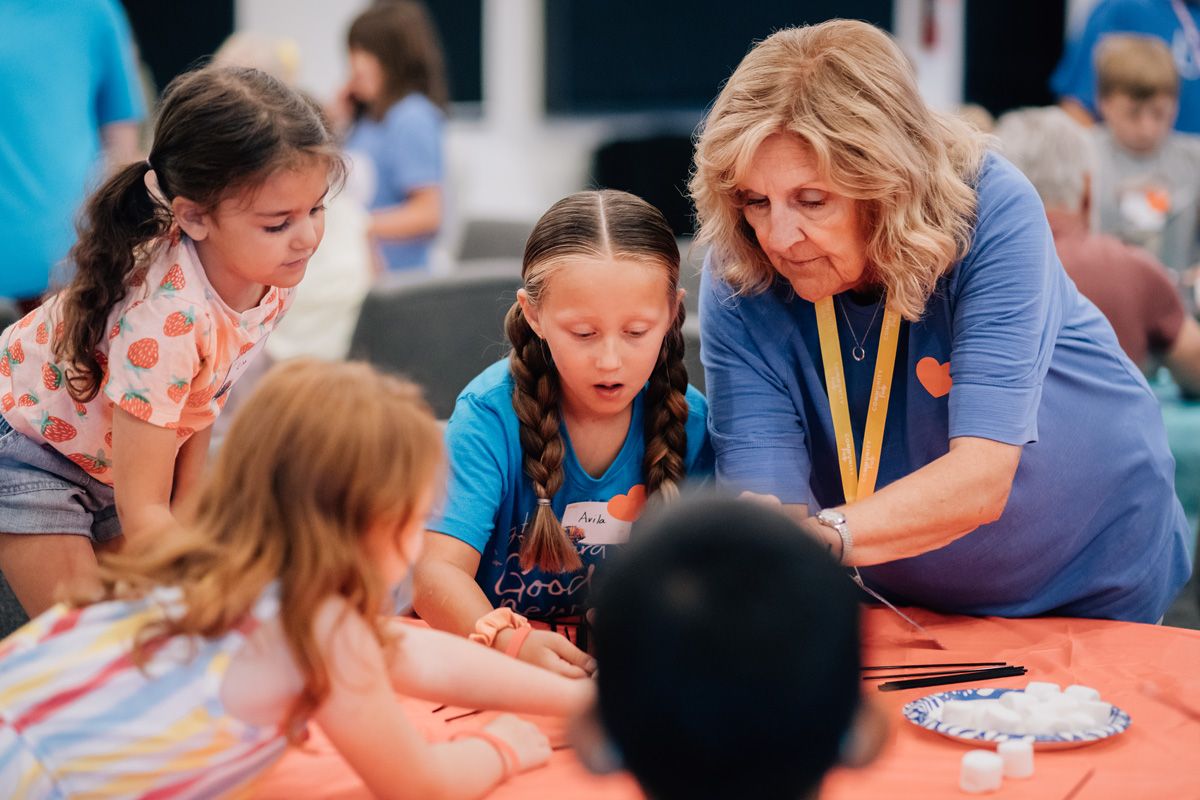 VBS Teacher Helping Students