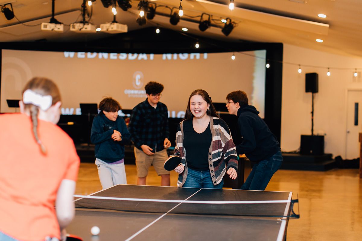 student youth group playing volleyball