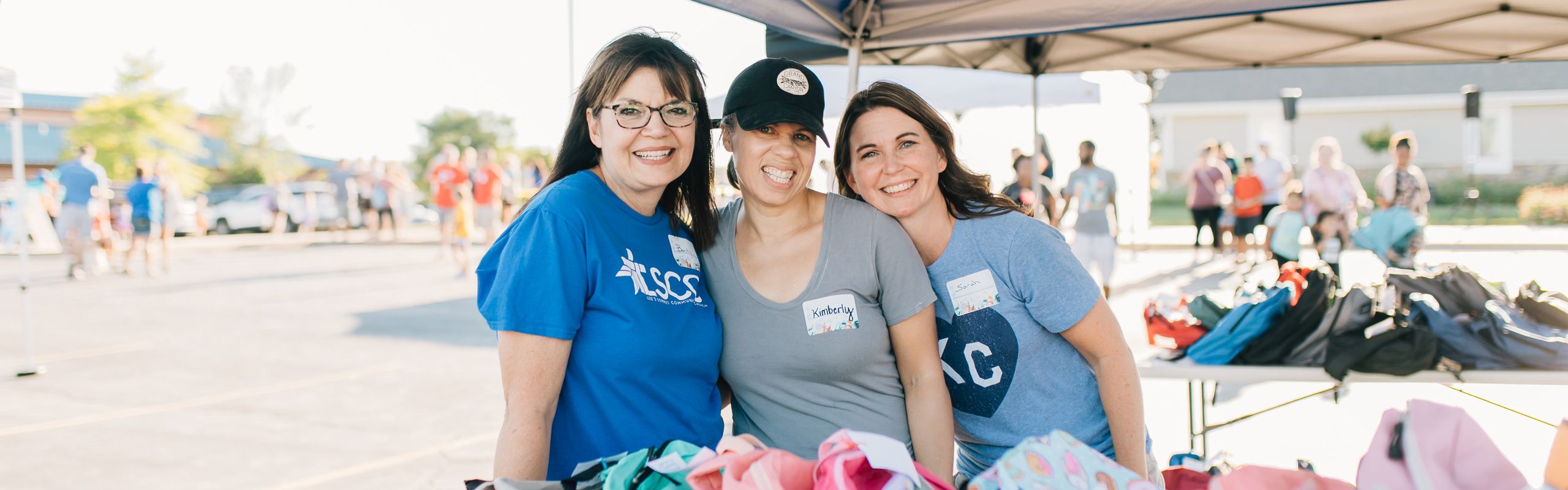 group of women serving at local back to school event