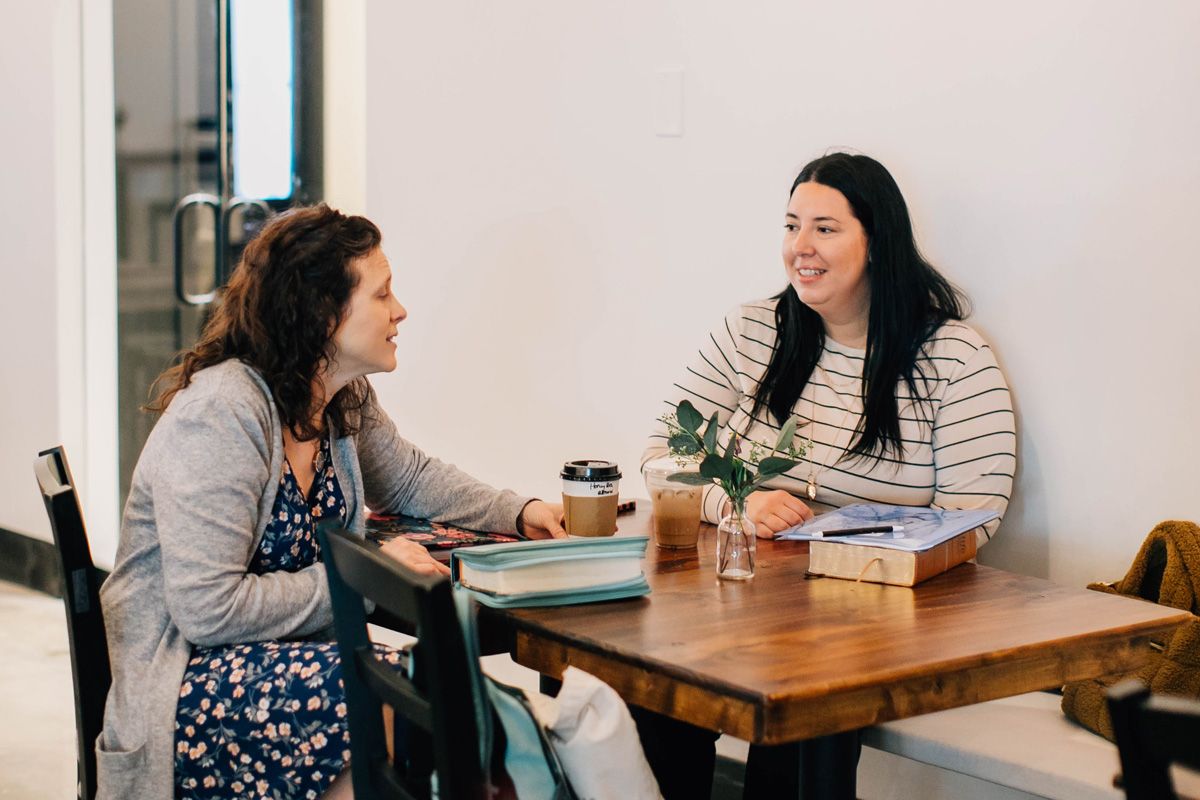 women meeting and chatting over coffee