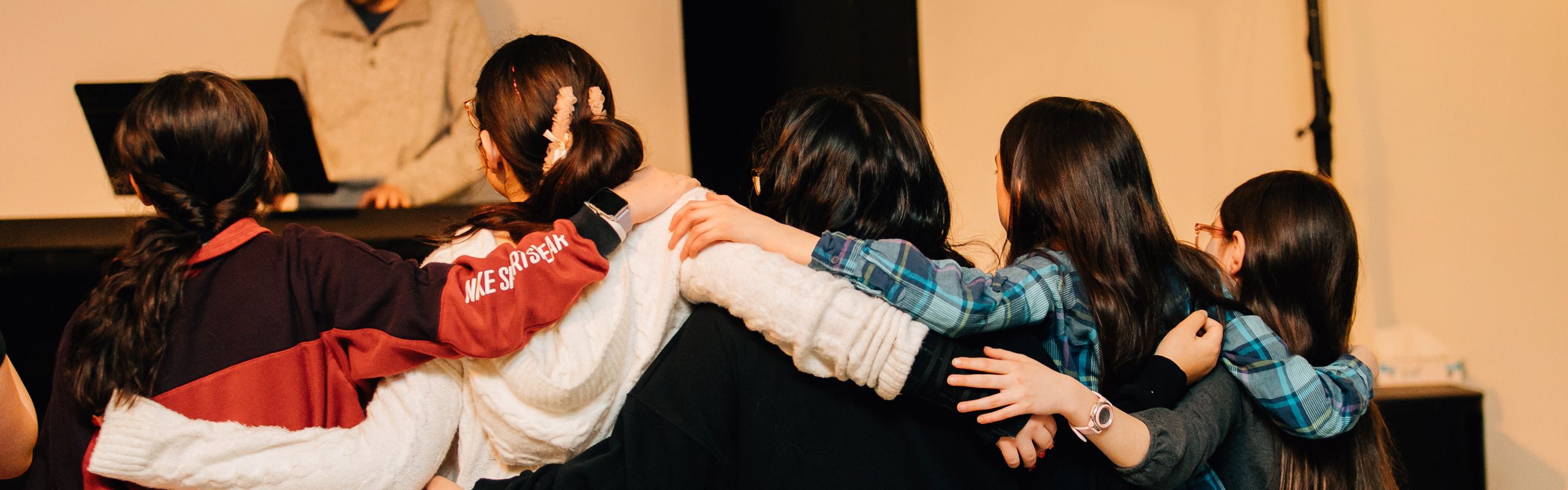 girls youth group participating in worship