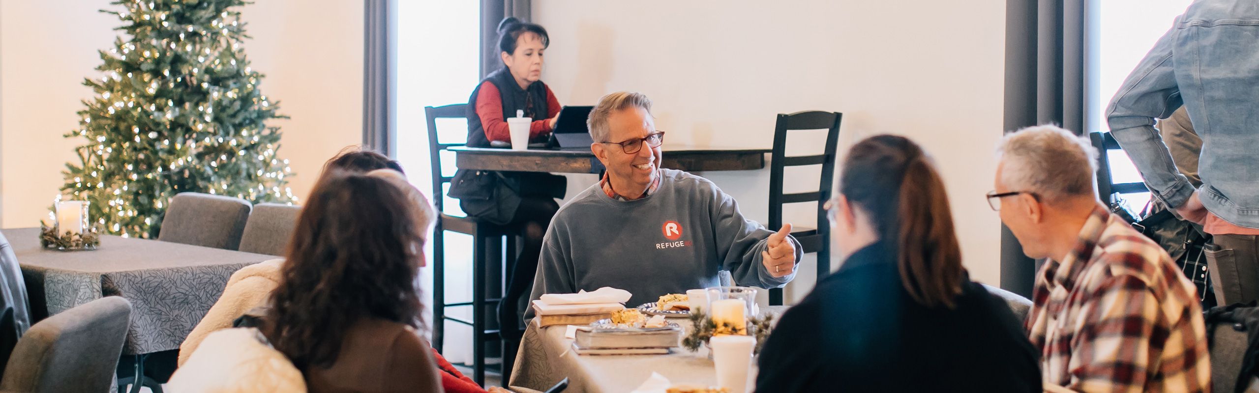 discussing international missions over meal in community cafe