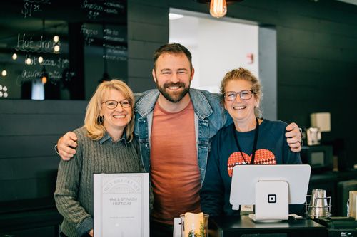 staff serving at community cafe
